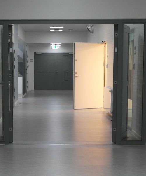 Corridor with psychiatric hospital with many doors from DAN-doors