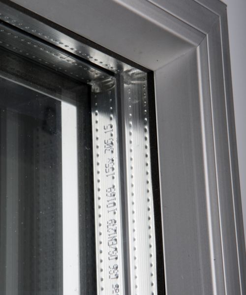 PC swing door with black wear plate in combination with hinged security door in stainless steel